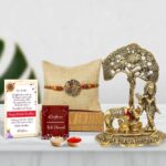 eCraftIndia Designer Peacock Rakhi with Lord Krishna Idol Playing Flute Under